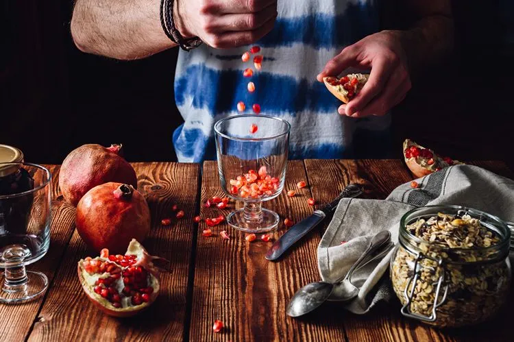 Pomegranate seeds being prepared — pomegranate is one of the strongest natural boosters of Akkermansia muciniphila